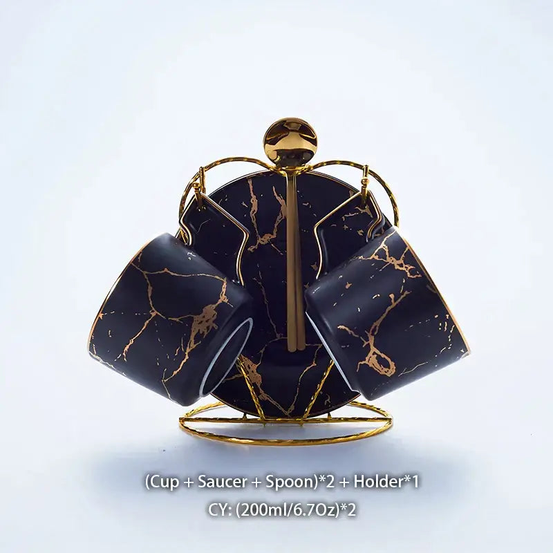 Elegant black marble ceramic tea set with gold accents displayed on matching gold metal stand for dining room use