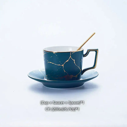 Elegant deep teal ceramic tea set with gold marble crackle design and matching saucer for refined dining use