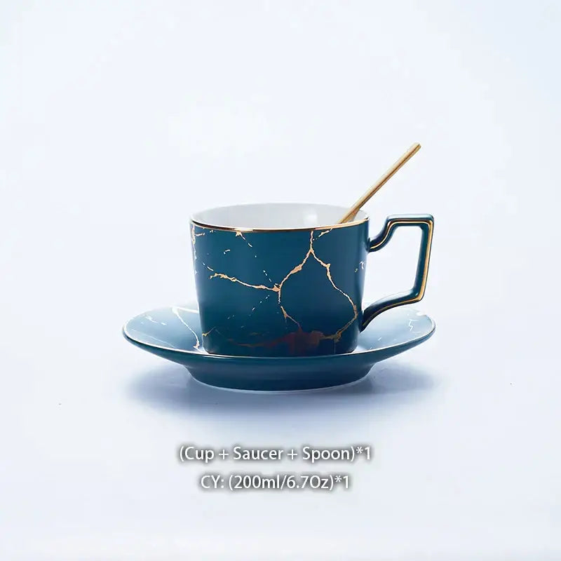 Elegant deep teal ceramic tea set with gold marble crackle design and matching saucer for refined dining use