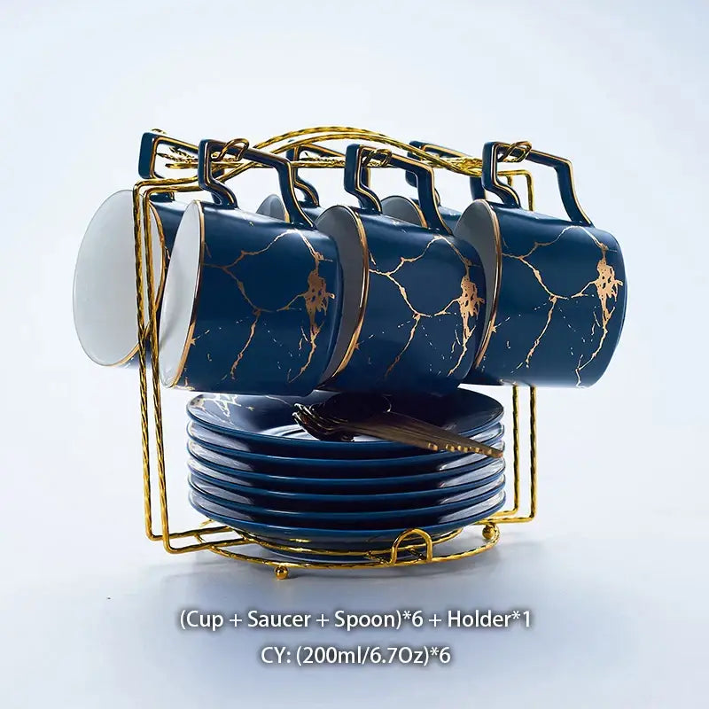 Set of six navy blue ceramic tea set with gold marble crackle design and matching saucers on a golden holder