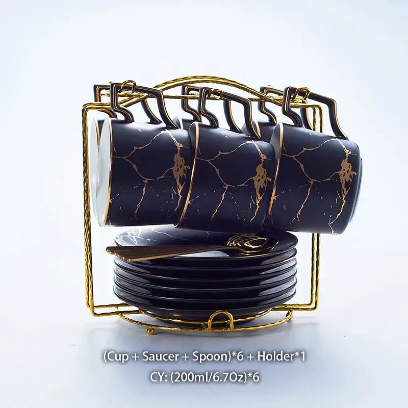 Elegant black marble ceramic tea set with gold veining includes six cups each with saucer and spoon in gold holder