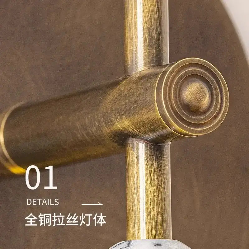 Antique brass-finished pull filament wall lamp with textured brushed metal and circular end cap for decorbites elegant marble copper design