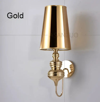 Elegant gold-toned decorbites guards wall lamps set featuring polished brass detailing and conical wall lamps for bedroom use