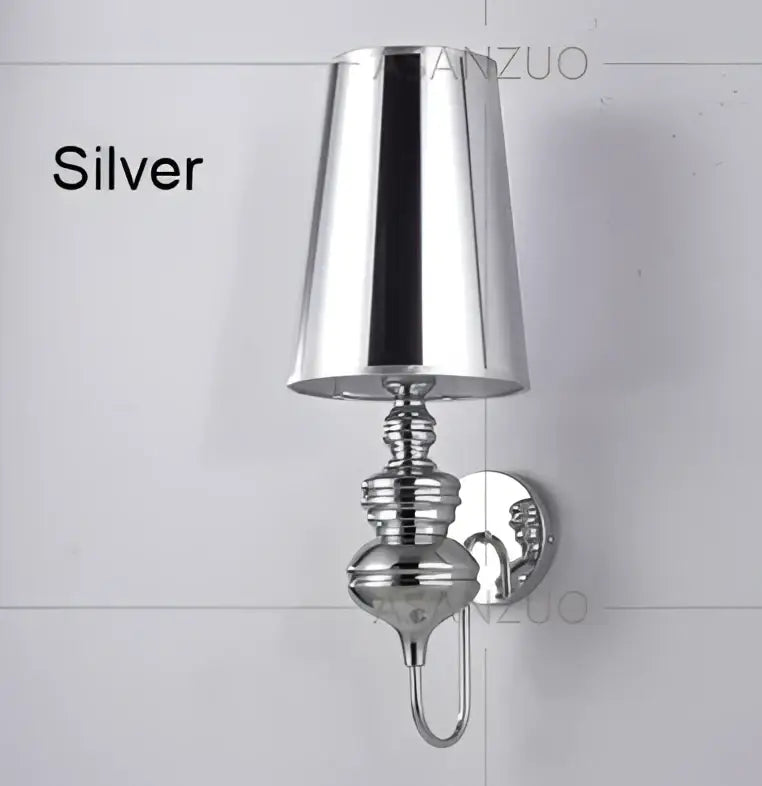 Silver metallic wall lamps with conical shade and ornate base from decorbites guards wall lamps set for bedroom