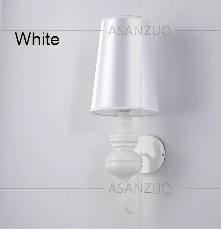 Elegant white ceramic wall lamp with tapered lampshade and decorative base from decorbites guards wall lamps set for bedroom