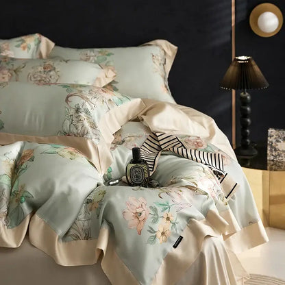 Elegant mint floral eucalyptus fiber bedding set in satin with soft pink peach patterns and cream ruffled edges for decorbites