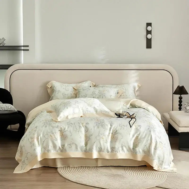 Cream-colored satin bedding set with gold and gray floral embroidery made from decorbites eucalyptus fiber bedding