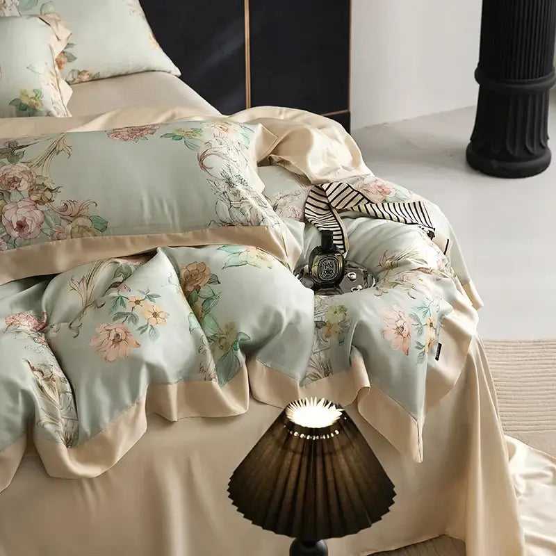 Elegant mint floral eucalyptus fiber bedding set featuring light blue satin with cream ruffled edges and matching pillowcases