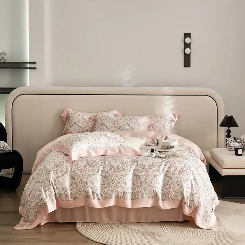 Elegant pink satin bedding set with silver floral pattern and ruffled edges made of decorbites eucalyptus fiber