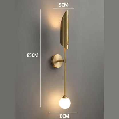 Elegant modern wall lamp gold-toned with sleek elongated leaf design and frosted glass bulb for bedroom decorbites elegant modern