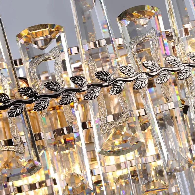 Elegant multi tiered pendant lights with clear faceted crystal prisms and silver leaf metal accents for dining room decorbites elegant room lights