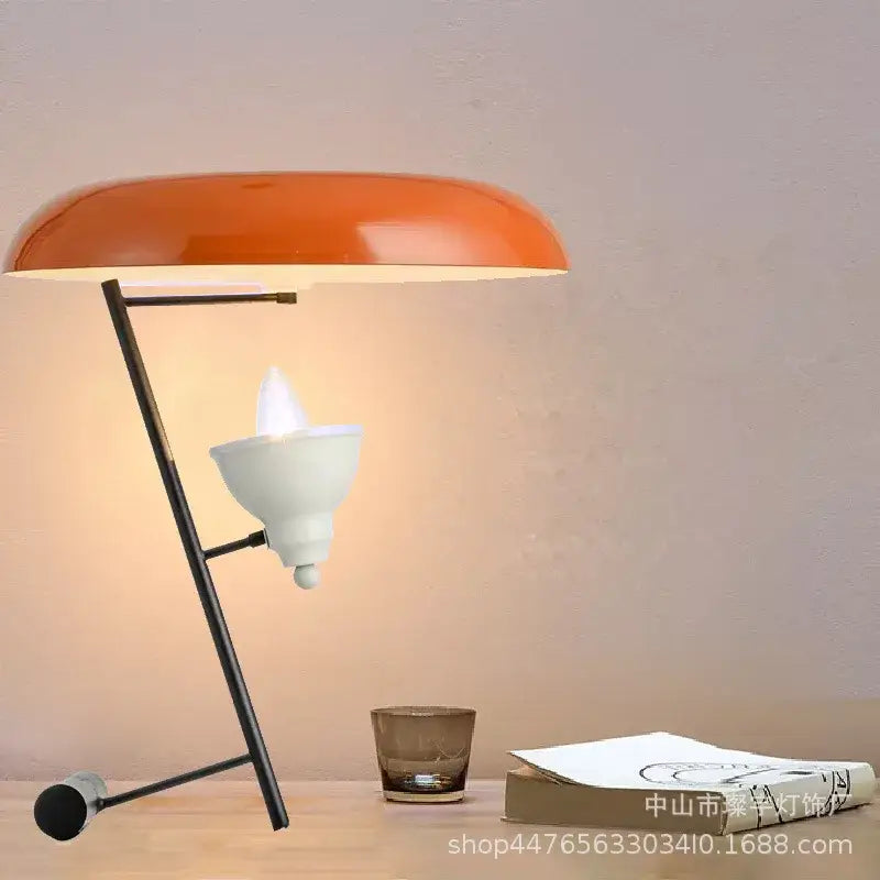 Orange dome-shaped desk lamp with black metal frame and white bulb housing decorbites elegant nordic desk light