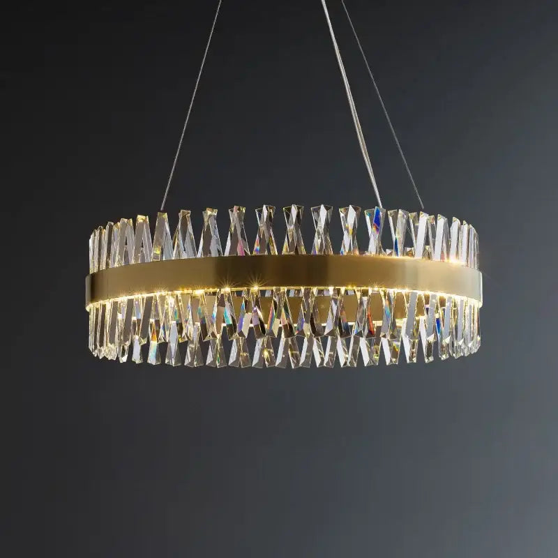 Elegant oval brushed gold rings crystal chandelier with a gold-toned frame and cascading clear prisms for dining room decorbites brushed gold