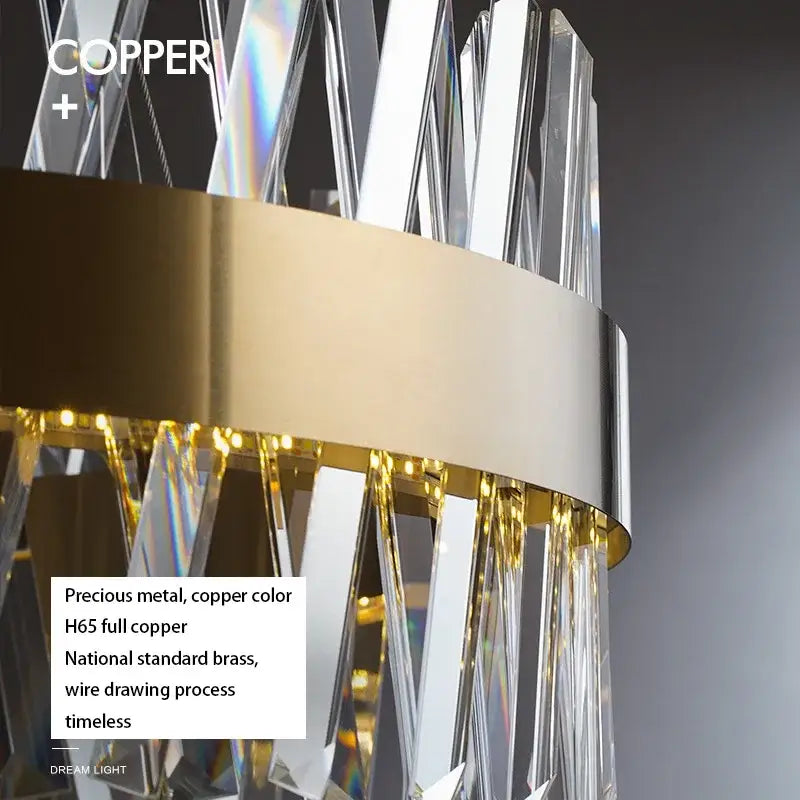 Copper-colored crystal chandelier with clear prisms and brushed gold rings metal frame for elegant dining room decorbites