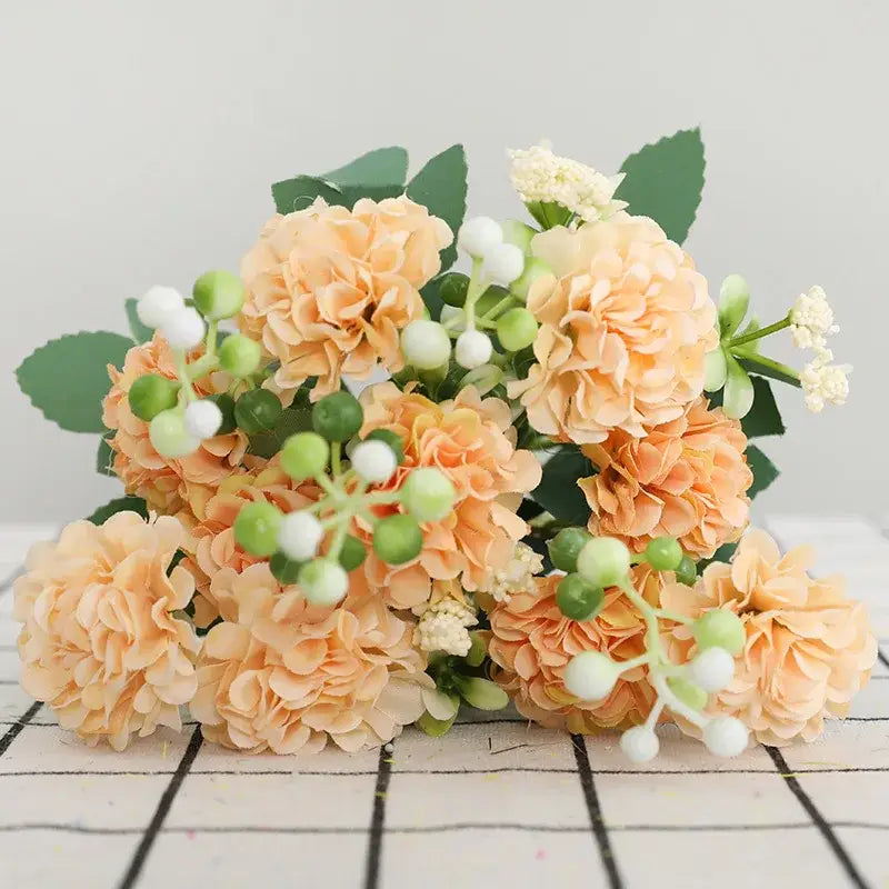 Elegant pink decorbites daisy bouquet featuring peach artificial flowers with green and white berries for living room decor