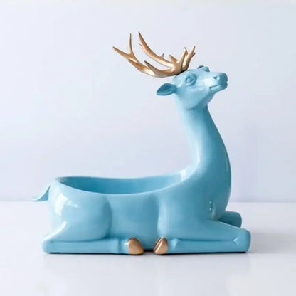 A sleek light blue ceramic resin deer key holder with golden antlers and hooves for elegant resin decorbites living room decor