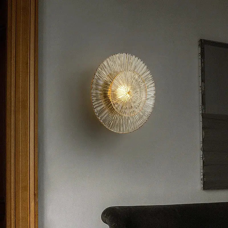 Elegant glass wall circular gold-toned ribbed glass wall sconces by decorbites emitting warm light for living room decor