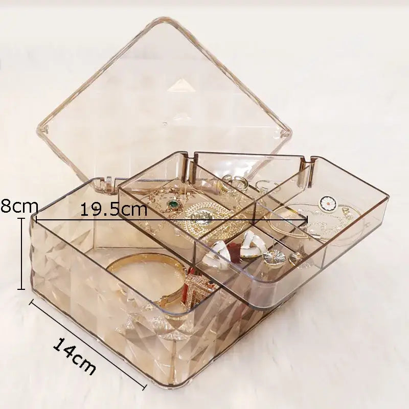 Elegant rose gold and silver transparent acrylic jewelry boxes with geometric compartments for organized elegant jewelry