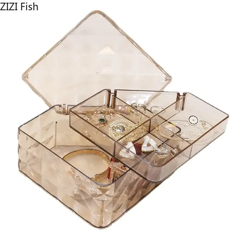 Transparent geometric-patterned acrylic jewelry box with hinged lid and compartments for elegant jewelry storage