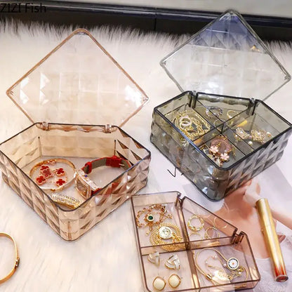 Elegant jewelry boxes made of clear acrylic with geometric patterns in rose gold and dark gray for bedroom organizers