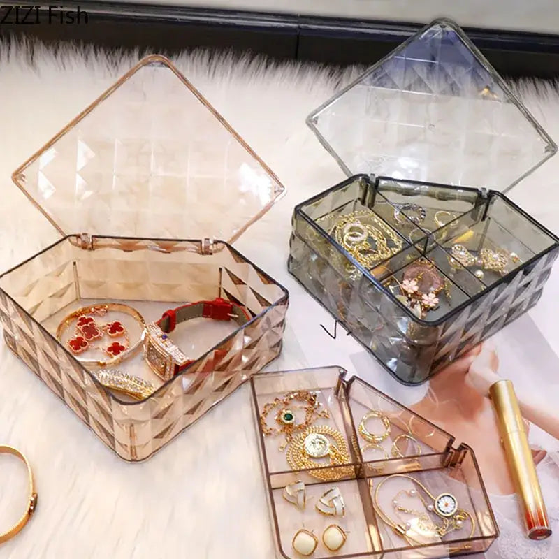 Elegant jewelry boxes made of clear acrylic with geometric patterns in rose gold and dark gray for bedroom organizers