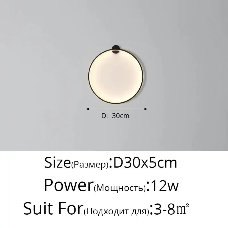 Circular minimalist wall sconces with sleek black frame and soft diffused glow for decorbites elegant round wall lighting