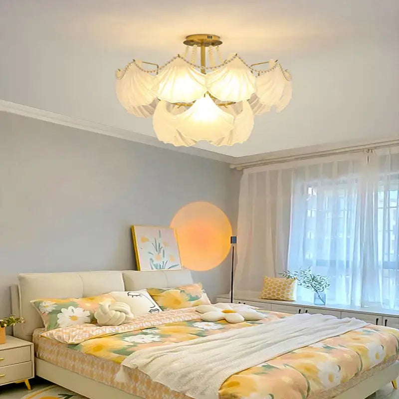 Elegant shell pearl chain chandelier with soft white fabric petals and gold metal frame for dining room decorbites crystal pearl