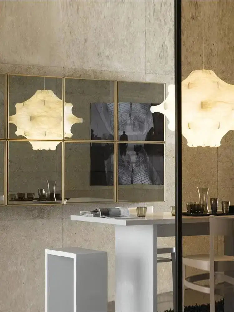 Gold-framed mirror with six reflective panels complements decorbites elegant silk pendant lamp white ruffled petal light