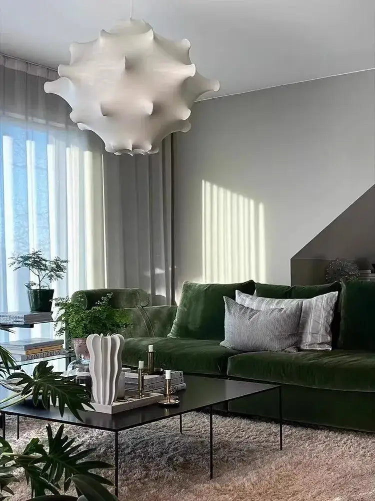 White sculptural pendant lamp with textured silk ruffled petals from Decorbites elegant silk pendant for living room decor