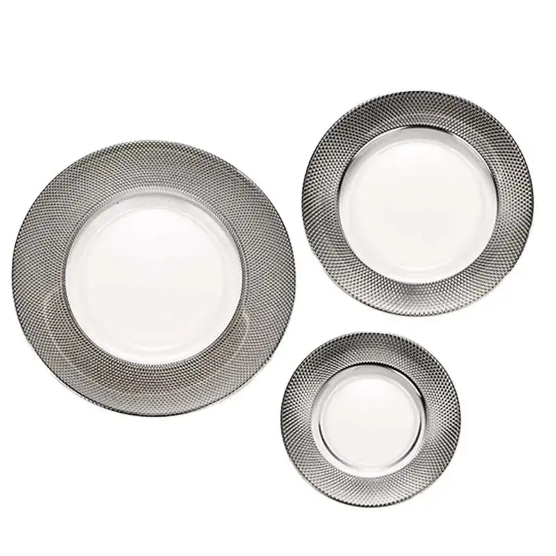 Set of three elegant glass steak and pasta plates with sleek silver textured rims and smooth white ceramic centers