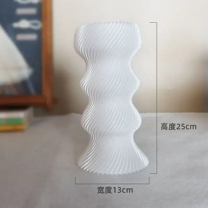 A sleek white ceramic decorbites elegant high-end vase with modern wavy ribbed design for living room decor
