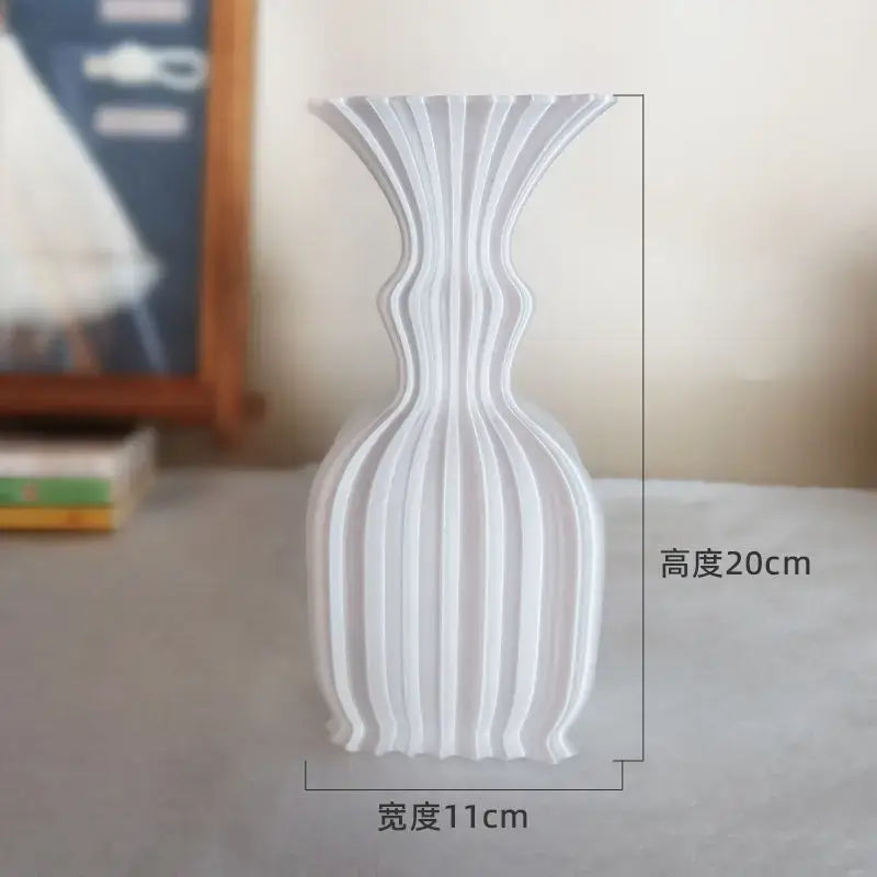 White ribbed ceramic vase with sleek modern design for decorbites elegant high-end living room decor