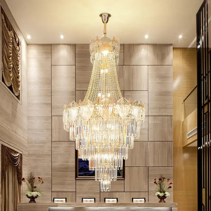 Elegant simple staircase chandelier featuring multi-tiered gold crystal prisms on a polished brass fixture for living room decorbites elegant simple design