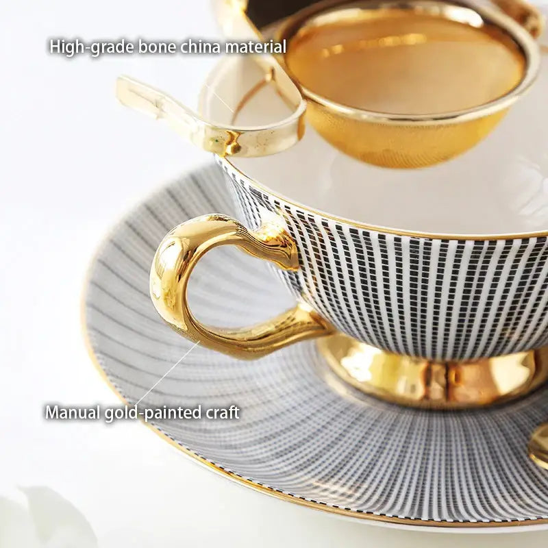 Elegant black and white striped porcelain tea cup with gold trim from a tea cup set for dining room use