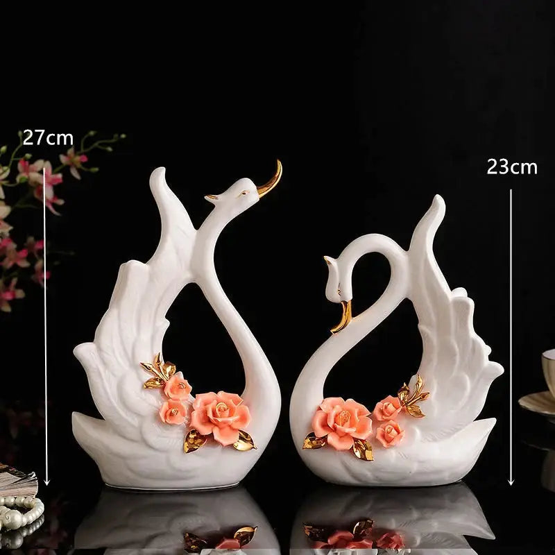 Elegant swan sculpture white ceramic figurines with gold accents and peach rose decor for living room by decorbites