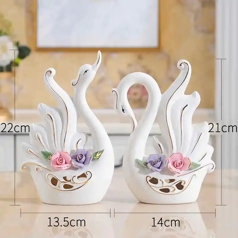 White ceramic swan sculpture figurines with gold trim and pink purple roses for elegant swan decorbites living room decor