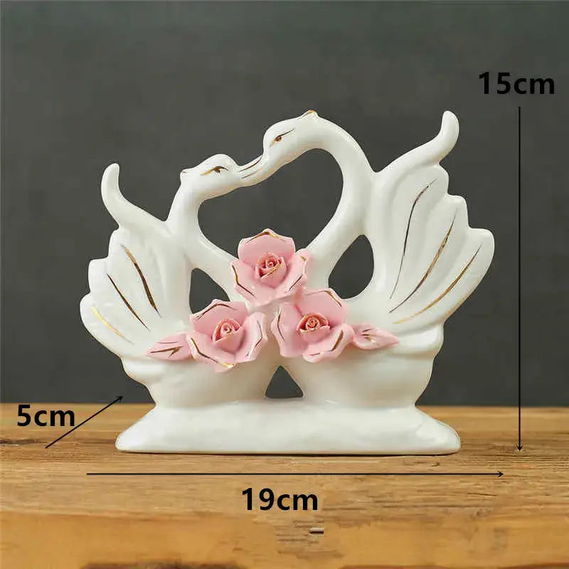 Elegant swan sculpture white ceramic figurine with pink roses and gold accents for living room decorbites elegant swan decor
