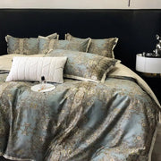 Elegant teal satin duvet cover with intricate gold floral embroidery and matching pillowcases luxury bedding set