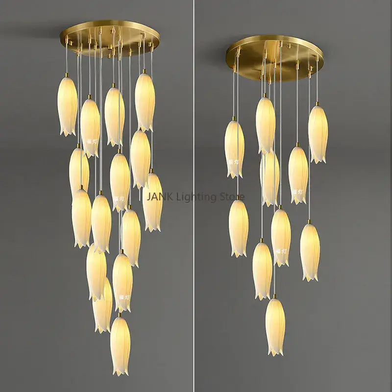 Gold-toned tulip staircase chandelier with cream frosted glass shades hanging from a circular brass base decorbites elegant tulip