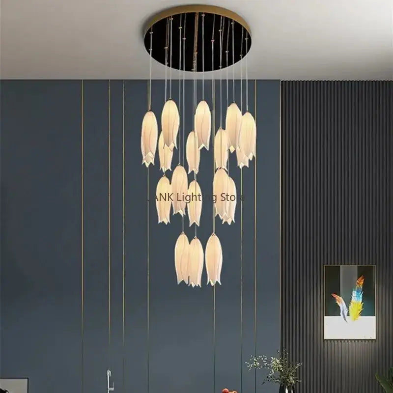 Modern cream-colored tulip staircase chandelier with gold frosted glass and circular black and gold ceiling mount by decorbites elegant tulip