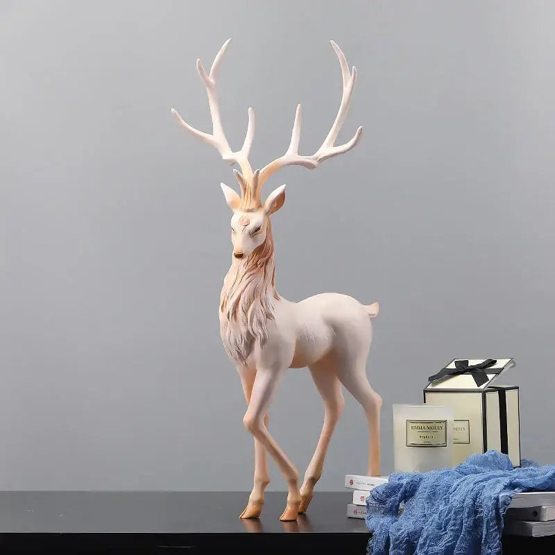 Elegant white elk figurine with gold antlers and soft pink mane by decorbites deer sculpture for living room decor