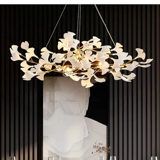 Elegant white and gold ceramic chandelier with ginkgo branch design ideal for dining room decorbites ginkgo branch