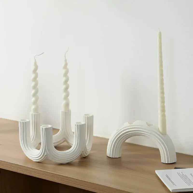 Elegant white ceramic candlestick holder with sculpted ribbed design and spiral candles for dining room decorbites elegant white decor