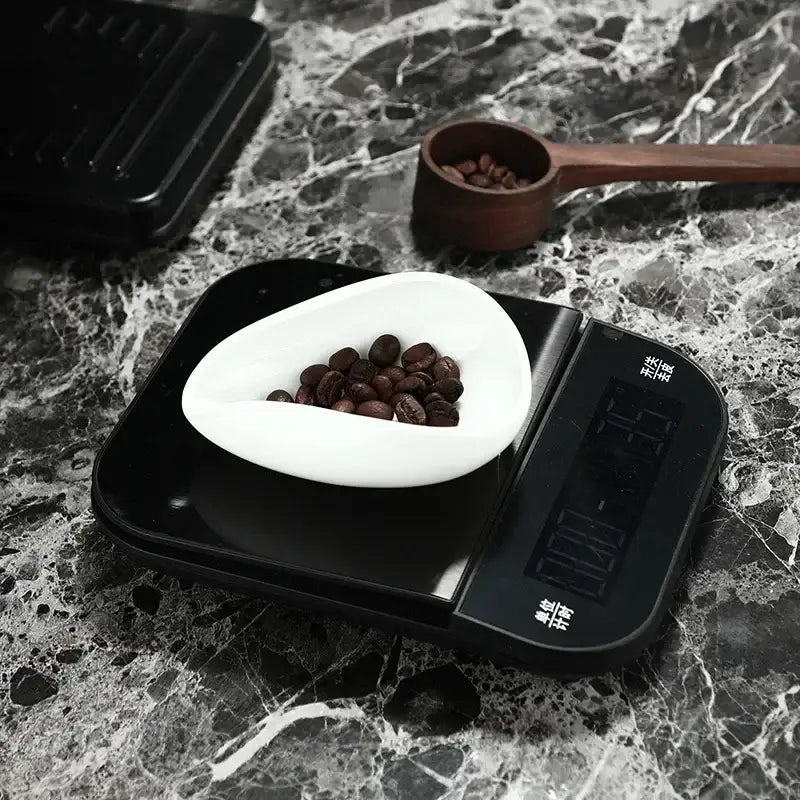 Black digital kitchen scale with white ceramic bowl from decorbites ceramic white dose trays and tea spoon set