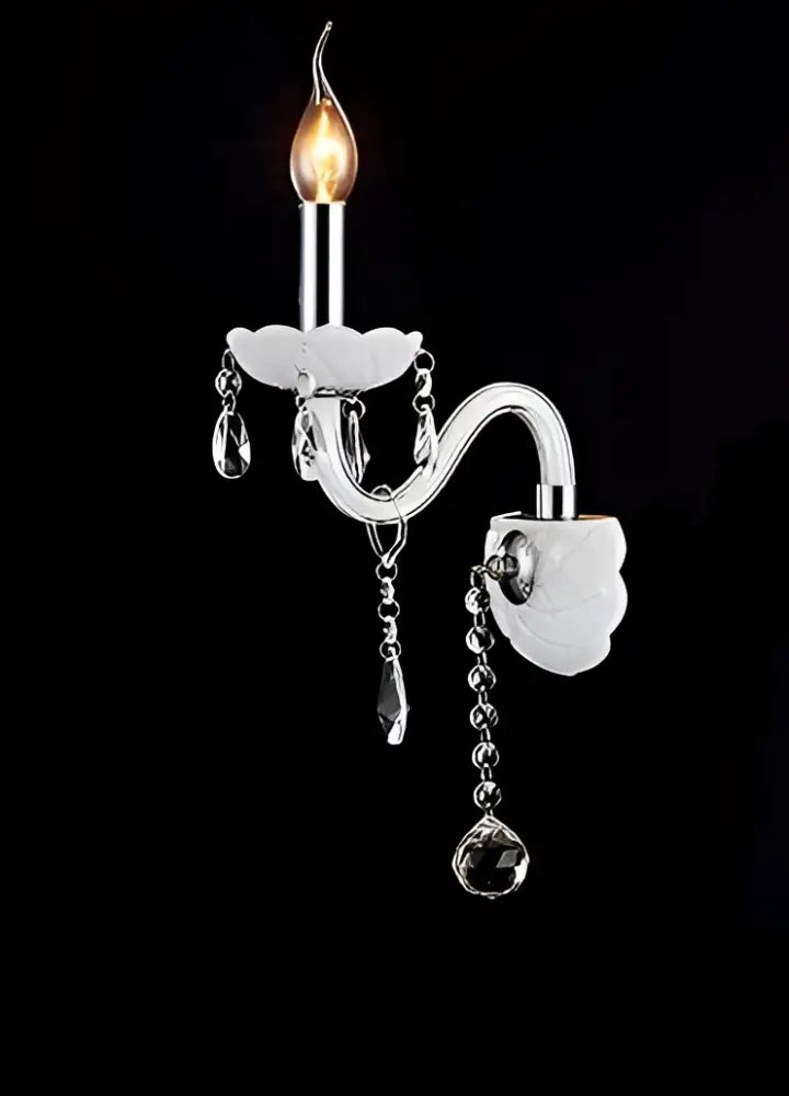 Elegant white crystal wall lamp with silver-toned curved arm, frosted fabric shades, and dangling teardrop crystals decorbites crystal wall