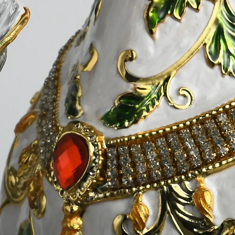 Elegant white enamel horse sculpture with gold leaf patterns, red gemstone centerpiece, and rhinestone accents for decor