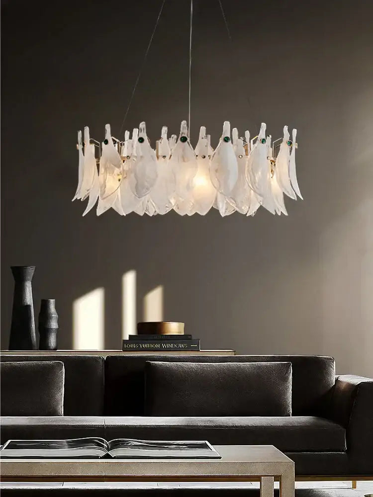 A modern decorbites cloud mist glass chandelier with translucent white feather-like elements and subtle green accents for bedroom decor