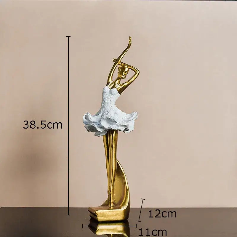 Elegant white and gold ballet dancer resin sculpture with textured tutu posed in arabesque for desk or bedroom decor