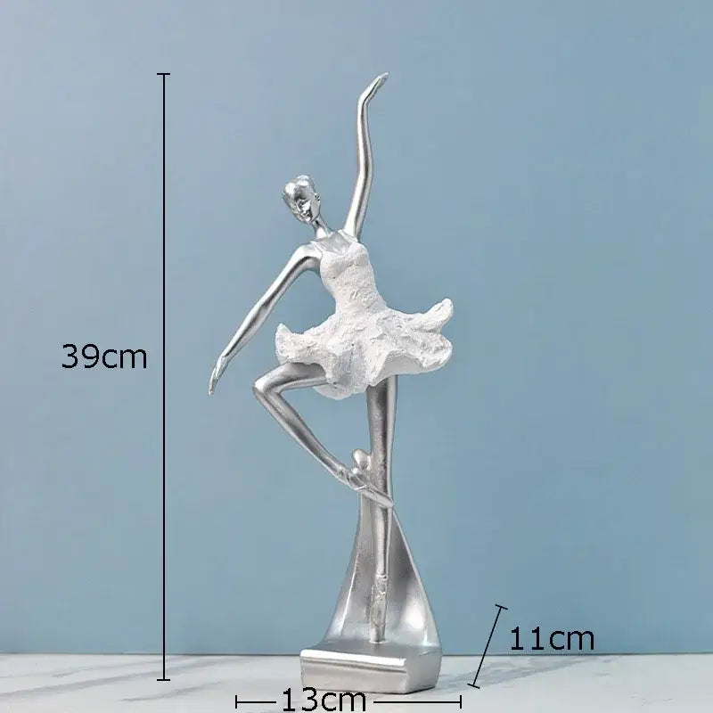 Elegant white and gold ballet dancer resin sculpture with silver textured tutu and sleek metallic finish on angular base