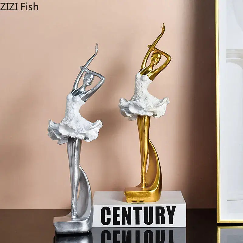 Two elegant ballet dancer resin sculptures in silver and gold with white ruffled tutus for bedroom decor